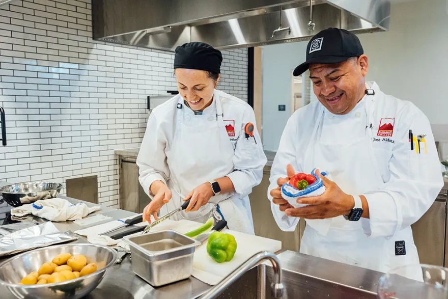 Two students cooking in the ATEP kitchen.