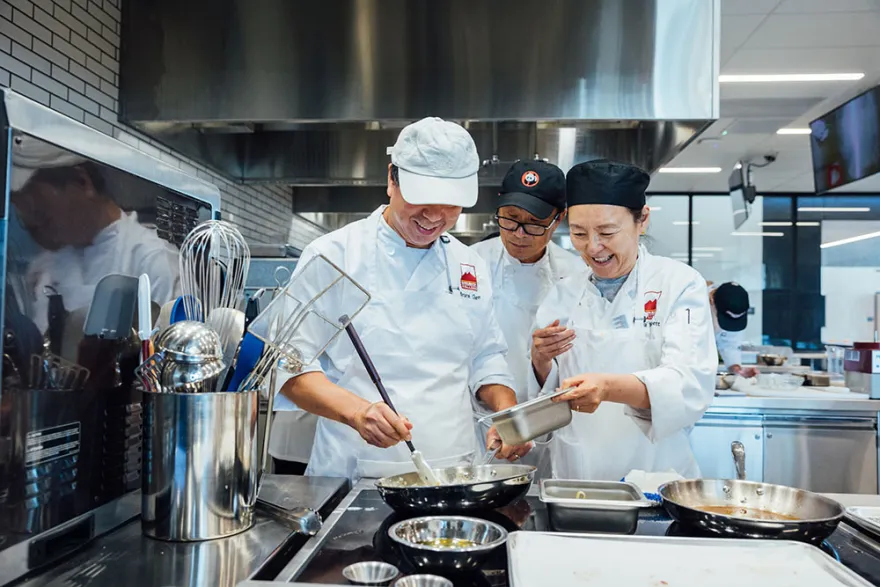 Students cooking in the ATEP kitchen.